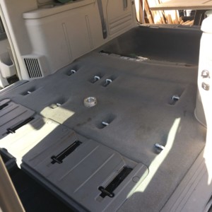 The removal of both stowaway seats preparing to add a 4 x 8 plywood to the floor